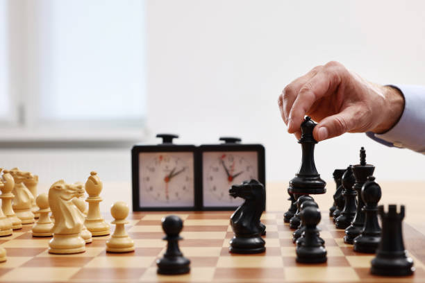 istock Man playing chess during tournament at chessboard, closeup 1901255124