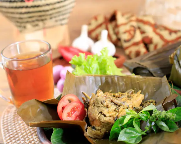 Indonesian Traditional Cuisine: Pepes Ayam or Steamed Chicken in Banana Leaf. Selected Focus