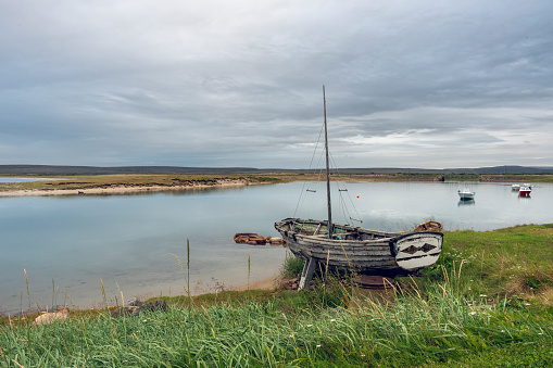 An old boat on the shore in the village of Skallelv, Northern Norway