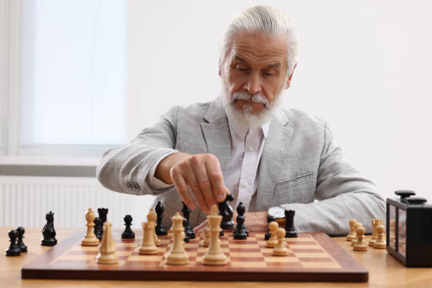istock Man playing chess during tournament at table indoors 1901263285