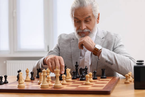 istock Man playing chess during tournament at table indoors 1901263796