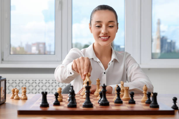 istock Woman playing chess during tournament at table indoors 1901264817