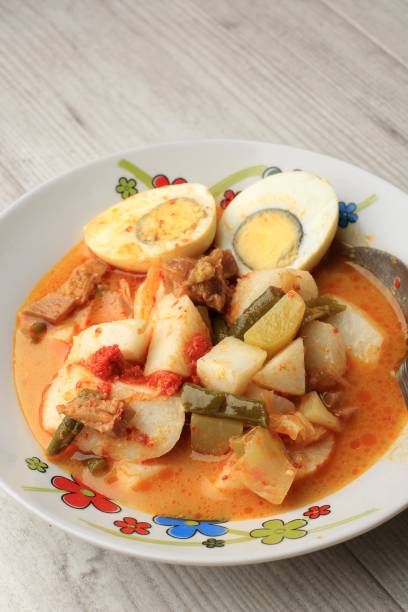 istock Lontong Sayur Padang, Vegetable Curry with Rice Pressed Cake, Served with Boiled Egg 1901297962