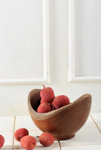 Litchi, Lichee, Lychee, or Lichi, Fresh Lychess Fruit on Wooden Bowl and  White Background, Isolated