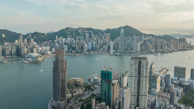 Aerial view of Victoria harbour, Hong Kong cityscape skyline in morning.
