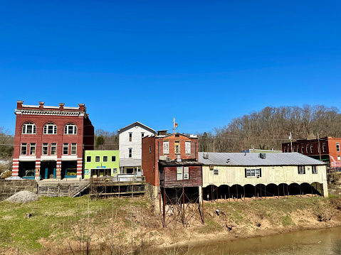 Cairo, West Virginia, USA - March 20, 2023: Buildings in downtown Cairo back to the North Fork Hughes River.