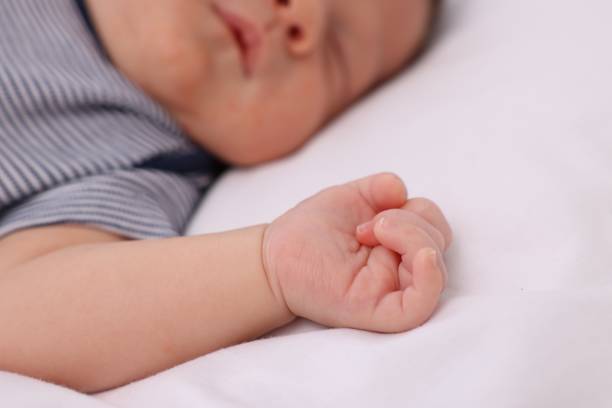 istock Cute newborn baby sleeping on white blanket, closeup 1901385381