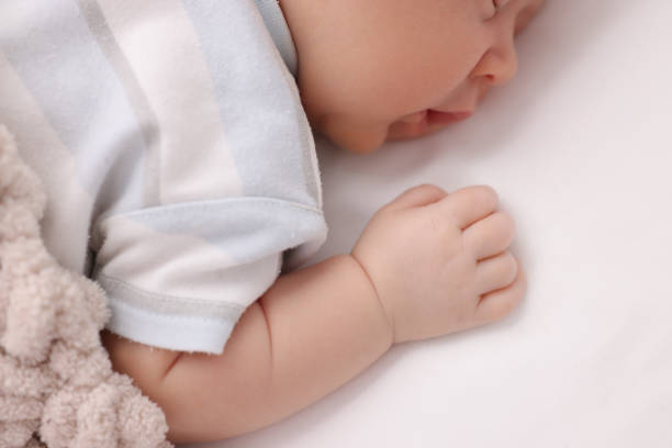 istock Cute newborn baby sleeping on white blanket, closeup 1901385923