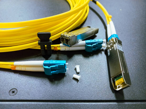 istock Single mode fiber optic patch cord cable with optical gigabit SFP module. 1901402990