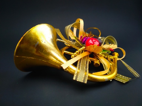Christmas trumpet decoration on a black background