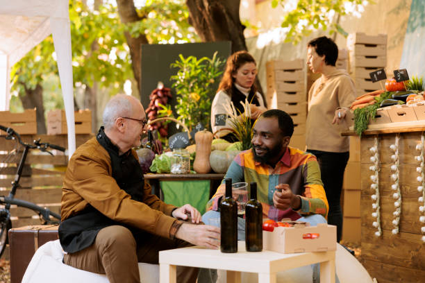 istock Man and vendor drink organic wine 1901472358