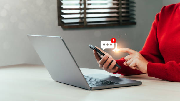 Hands of a businesswoman using a smartphone for answering emails with notifications online communication concept Buy things online