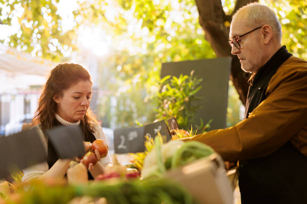 istock Father and daughter arrange bio products 1901489779