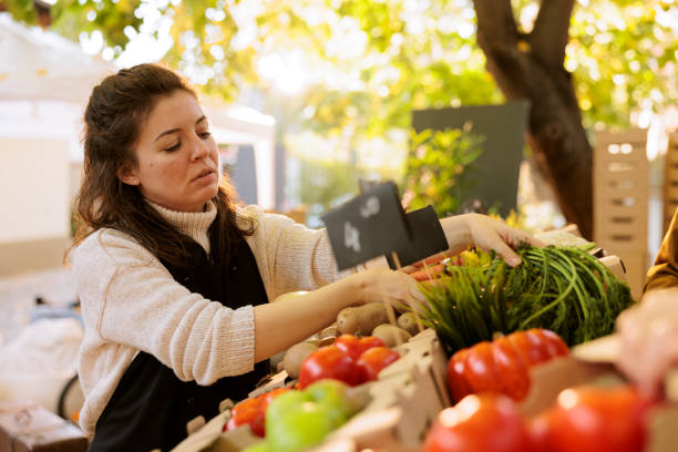 istock Vendor checking quality of organic items 1901502311