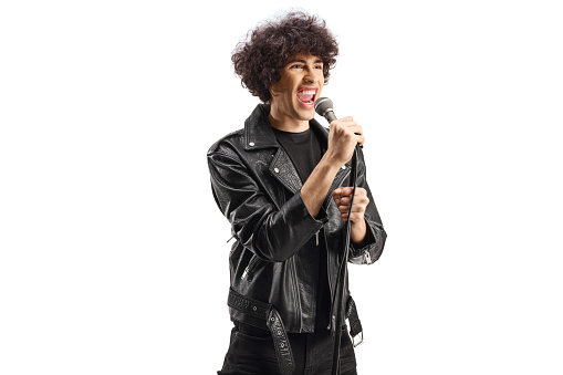 Singer in a leather jacket singing on a microphone isolated on white background