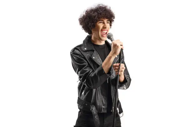 Photo of Singer in a leather jacket singing on a microphone