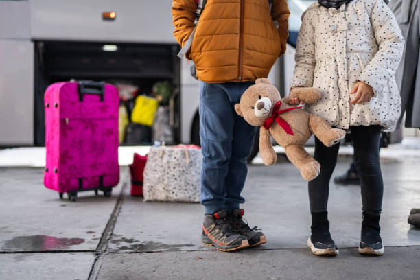 istock Little travelers on train station 1901535945