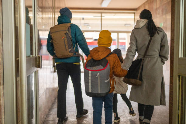 istock Happy family on train station 1901539539