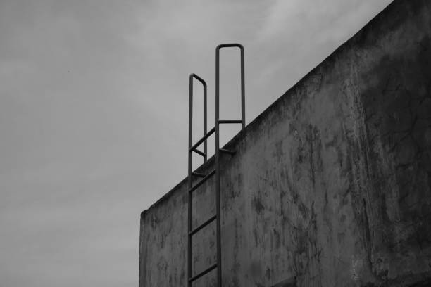 istock A house roof wall with an iron ladder 1901558161
