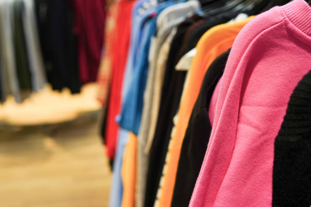 Second hand store with colorful clothes. Garage sale
