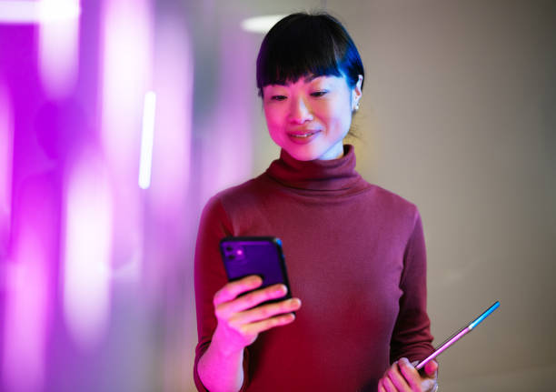istock Asian businesswoman using technologies in modern office. Businesswoman is using digital tablet and working late in the office 1901584847