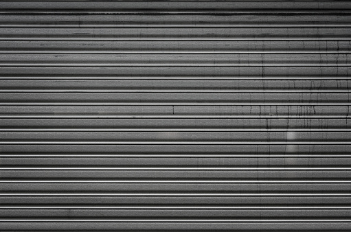 High resolution photograph of a metal rolling garage door.