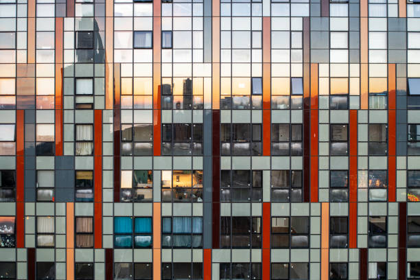 istock Mirror skyscraper wall background. Glass windows of temporary building 1901616118
