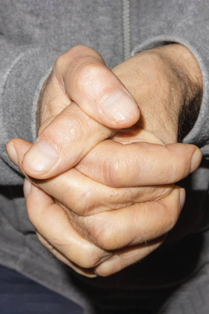istock The old man crossed his fingers up close 1901648442