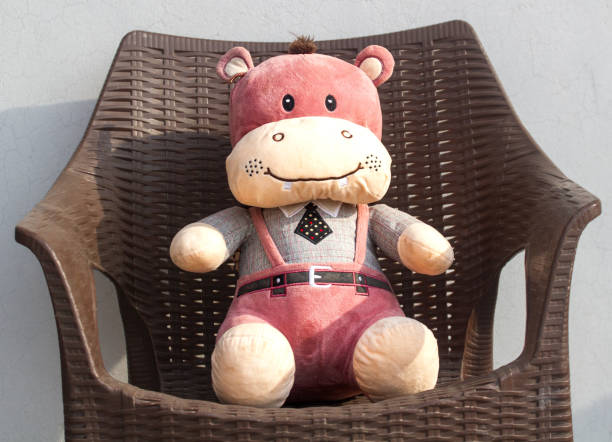 istock Teddy bear sitting in chair 1901648979
