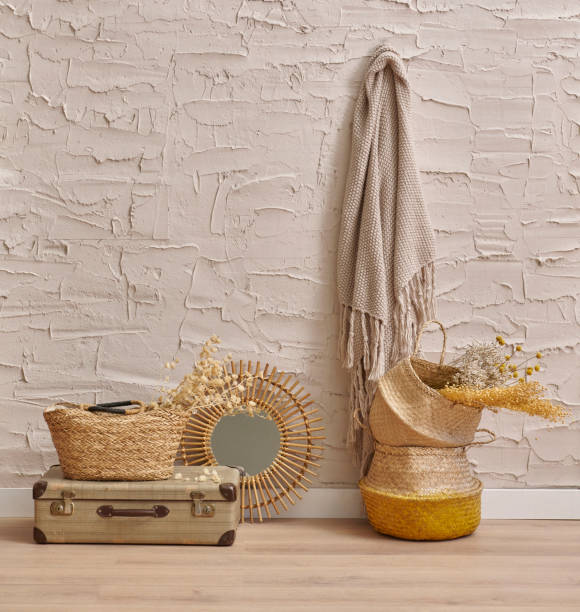 istock Wicker home object, bag, vase, mirror, baggage, plant in front of the concrete stone wall background, cotton dry plant, hanging, chair, blanket, decoration interior house room. 1901683634