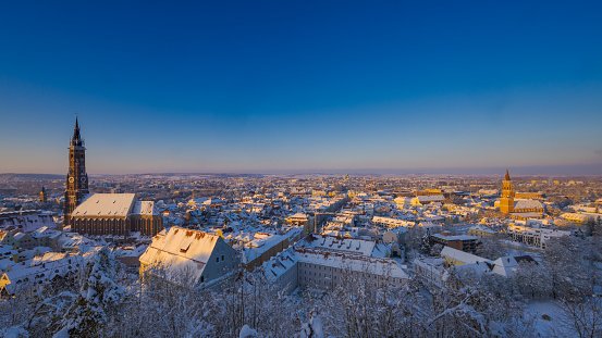 snowy park alongside the river in berlin with cathedral and tv tower in the background