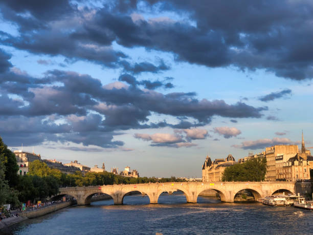 istock sunset view of bridge on Seine river in Paris 1901692018