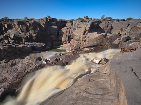 The Augrabies Falls is a waterfall on the Orange River, the largest river in South Africa. The falls set in a desolate and rugged milieu, is enclosed by the Augrabies Falls National Park
