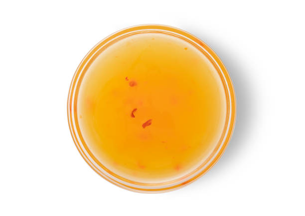 istock Glass bowl with mango sweet and chilli sauce on white background.Top view.Macro. 1901734240