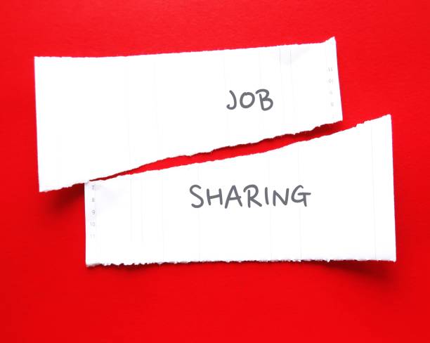 istock Two ripped paper on red background with handwritten text JOB SHARING, means two or more part-time workers perform the work of one full-time person, which is come back trend after pandemic 1901751022
