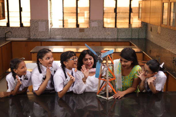 istock Science teachers explaining a handmade windmill project made by students in the laboratory. 1901754764