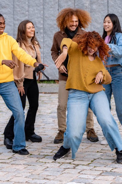 istock Joyous dance moment among vibrant friends 1901765268