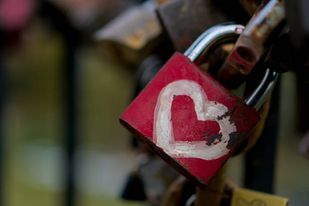 istock Lovelock white heart on red closeup horizontal shot blurred background 2 1901770871
