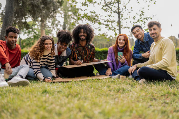 istock Young activists looking at camera for photo while preparing posters for social movement about equality and social problems 1901777226