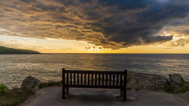 Sunset with dramatic clouds near Porthmeor Beach in St Ives, Cornwall, England, UK