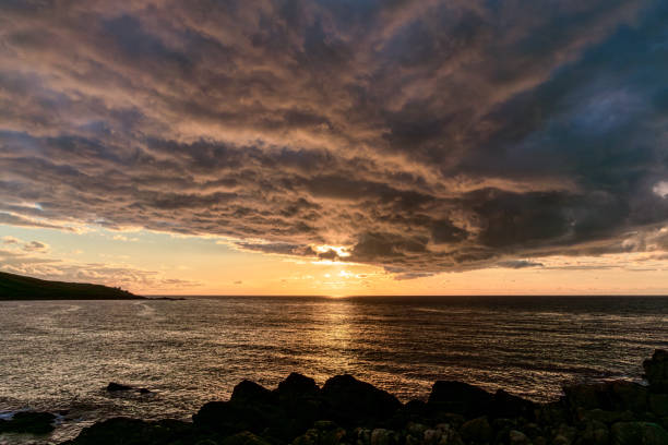 Sunset with dramatic clouds near Porthmeor Beach in St Ives, Cornwall, England, UK