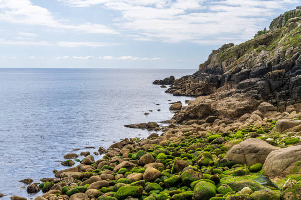 Celtic Sea Coast and cliffs at Lamorna Cove Beach, Cornwall, England, UK Celtic Sea Coast and cliffs at Lamorna Cove Beach, Cornwall, England, UK lamorna cove stock pictures, royalty-free photos & images