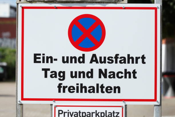 istock Keep entrance and exit clear day and night, Absolute stopping ban 1901810946