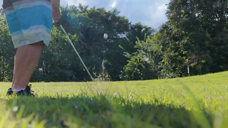 Close-up golf driver hitting the ball close-up