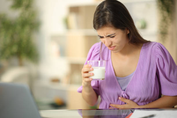 istock Woman drinking milk suffering belly ache at home 1901838229