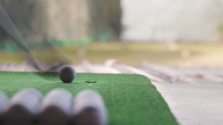 Close-up golf driver hitting the ball close-up