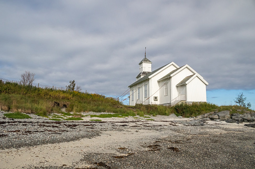Gimsoy Church, Gimsoya, Lofoten Islands, Norway, viewed from the beach