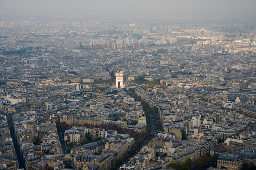 Immerse yourself in the heart of Paris with this breathtaking drone view of the Arc de Triomphe and radiating avenues.