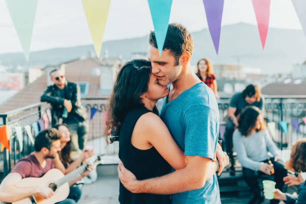 friends drinking and partying on the rooftop - individual event women people autumn imagens e fotografias de stock