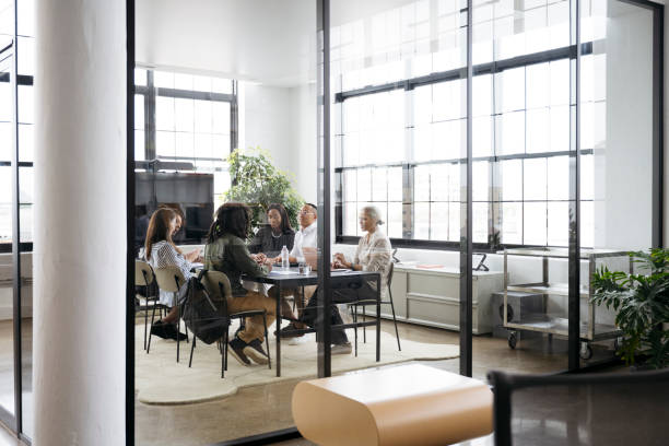 Marketing team conversing in meeting room